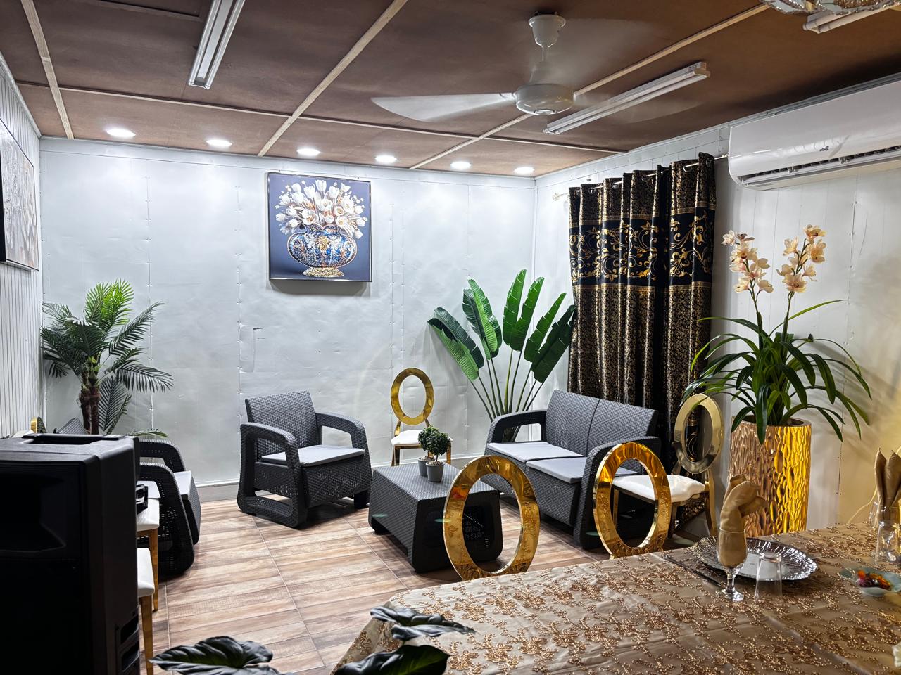 Private gazebo lounge area with gold accents and tropical greenery